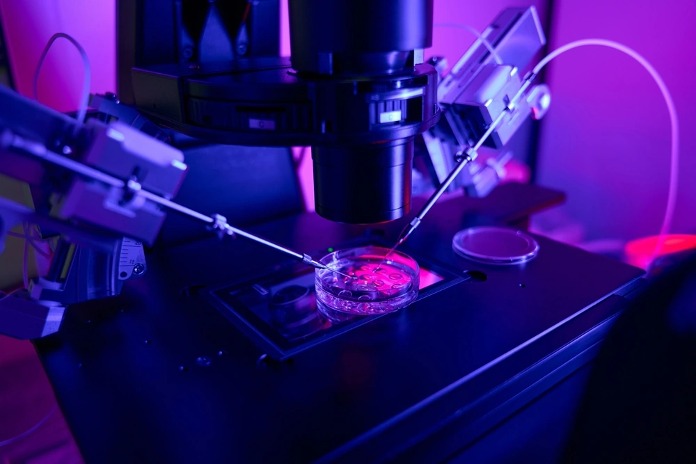 Close up of scientist laboratory worker doing microinjections